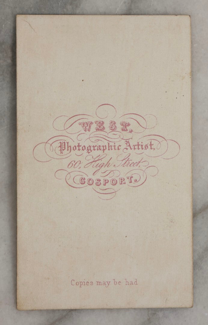 Lot 123 - Antique Carte De Visite C.D.V.. Photograph Of Black Man In Double-Breasted Jacket With Cap In Hand, Photographed By George West, Gosport, England, With Maritime-Themed Backdrop