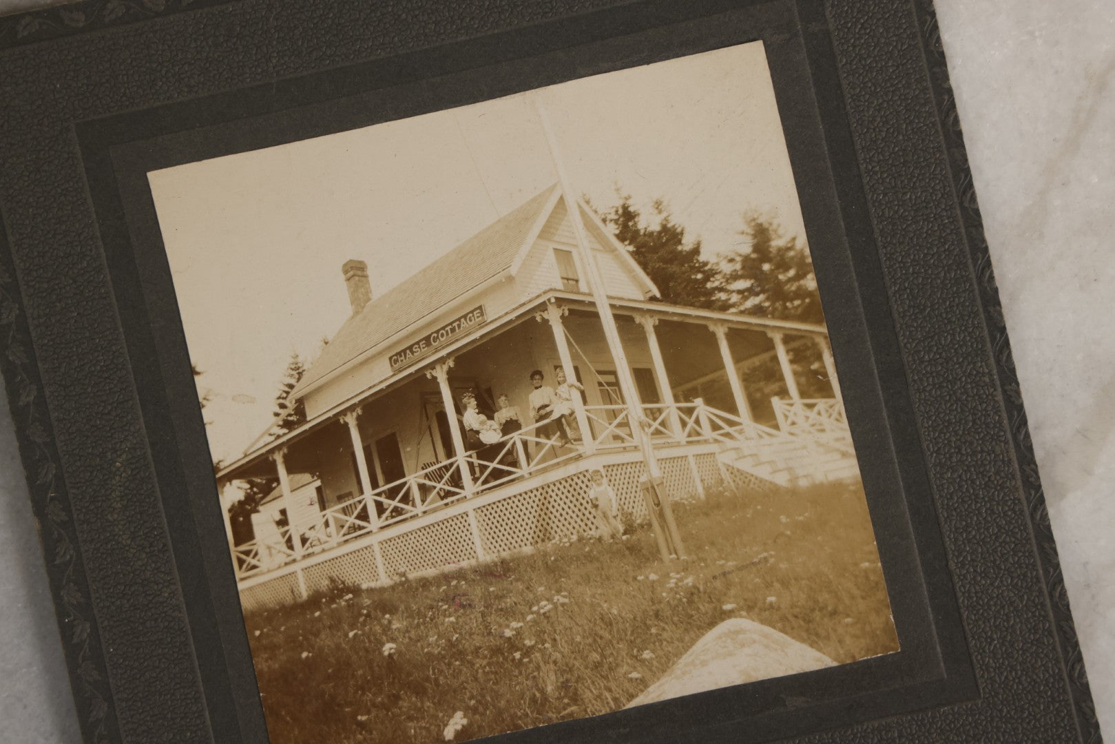 Lot 128 - Grouping Of Five Antique Outdoor Boarded Photographs, Victorian Era, Including Woman Fishing July 1896; Three Women Seated On Rocky Shore; Large Group With Dog June 1896; Ladies Posed On Porch Of “Chase Cabin”; And Group With Dog