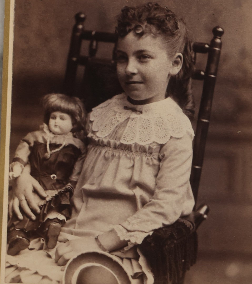 Lot 132 - Antique Cabinet Card Photograph Of Little Girl Posing With China Head Doll, Photographed By Oflehley, Rockford, Illinois