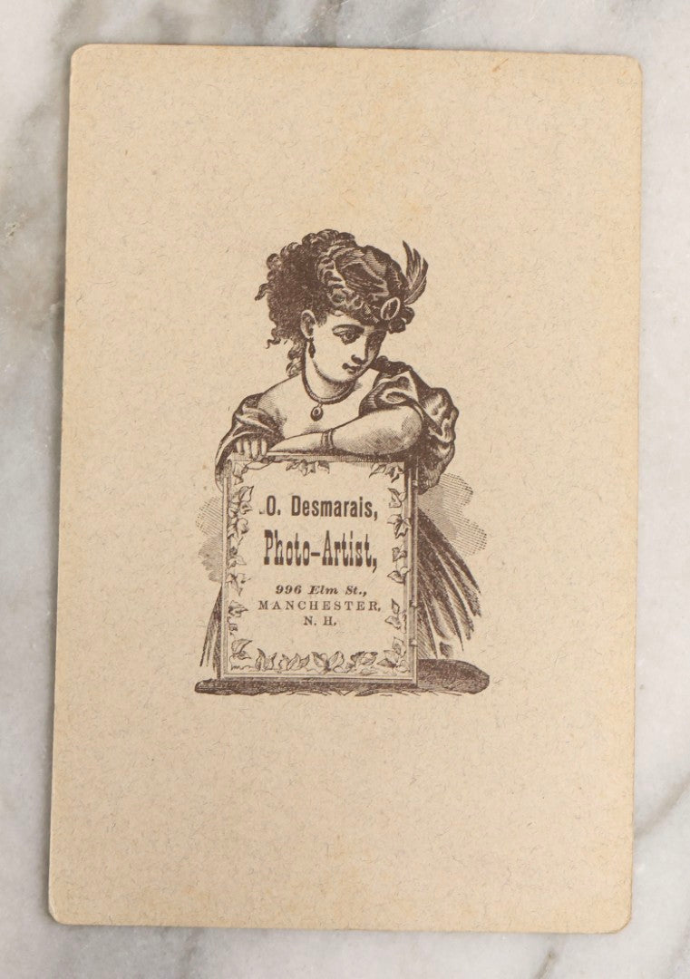 Lot 133 - Antique Cabinet Card Photograph Of Twelve Women Posed With Sewing Tools And Apparatus, Including Thread, Bobbins, And Scissors, Photographed By O. Desmarais, 999 Elm Street, Manchester, New Hampshire