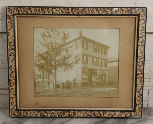 Lot 135 - Antique Framed Photograph Of Multi‑Story Wooden Storefront With Signage Alexstrom Skräddare ("Tailor"), Annotated On Reverse As Bystrom Family's “First Home In America – Greenwood St. Next To Lutheran Church” Dated 1896, 13-3/4" x 11-3/8"