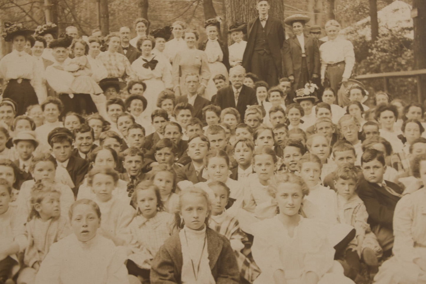 Lot 137 - Antique Boarded Photograph Of Large Group Of Children In Woodland Clearing With Adults Standing Behind, Likely Summer Camp, Photographed By Moon Co. Photo, Worcester, Massachusetts, June 28, 1910
