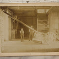 Lot 138 - Antique Boarded Photograph Of Large Hammer Machinery Display With Two Workers, Related To Caldwell Harness Exhibit At World's Fair, With Detailed Manuscript Note On Verso
