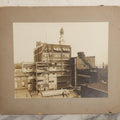 Lot 140 - Antique Boarded Photograph Of Urban Construction Scene With Multi-Story Buildings, Rooftop Water Tank, And “Wallace” Sign Visible