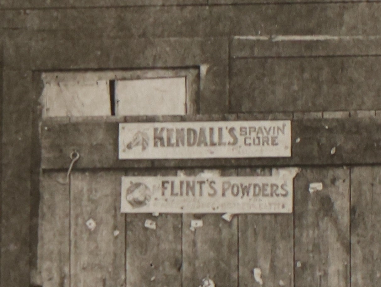 Lot 141 - Antique Boarded Photograph Of Garage With Early Automobile, Kendall's Spavin And Flint's Powder Signage, Three People With Wagon