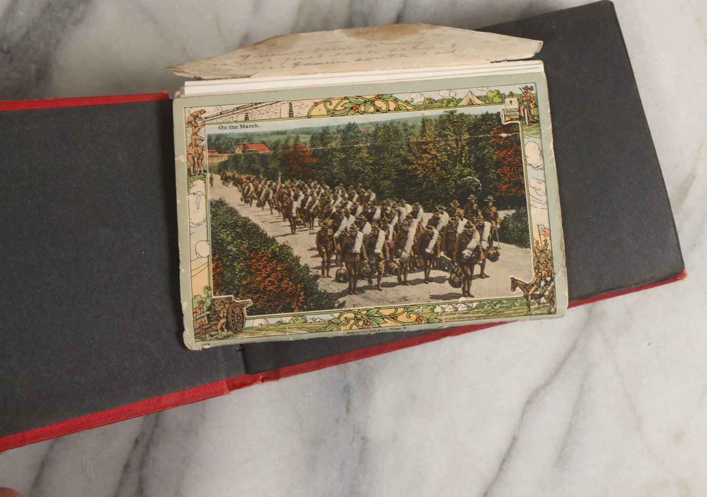 Lot 143 - Antique Postcard Album Containing 50 Postcards Including Numerous Real Photo Postcards R.P.P.C.S With World War One Soldiers, Sailor, Other Portraits, And U.S. Army Souvenir Postcard Folder