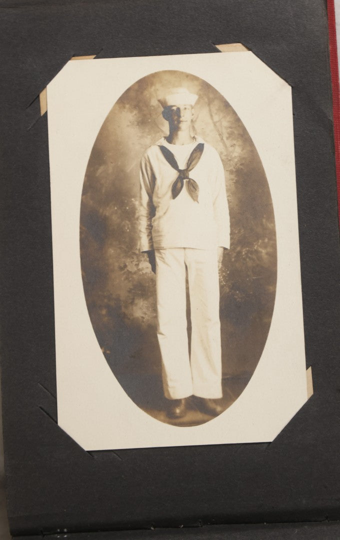Lot 143 - Antique Postcard Album Containing 50 Postcards Including Numerous Real Photo Postcards R.P.P.C.S With World War One Soldiers, Sailor, Other Portraits, And U.S. Army Souvenir Postcard Folder