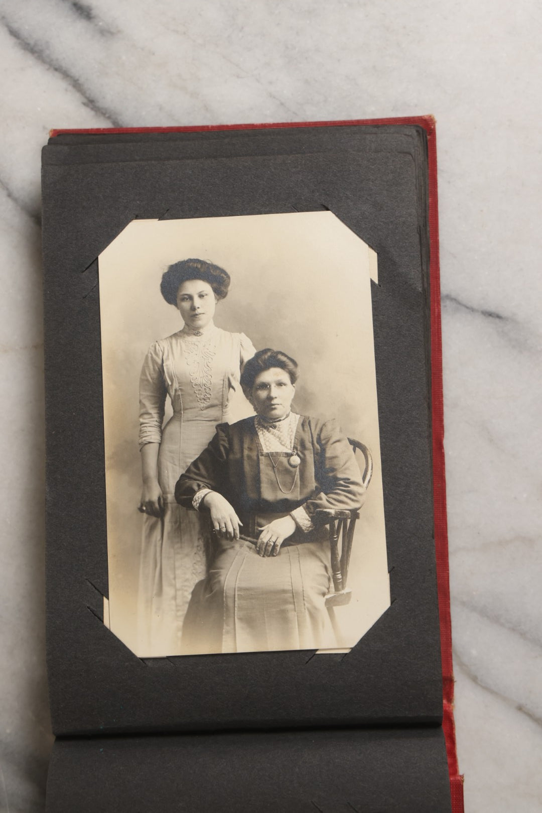 Lot 143 - Antique Postcard Album Containing 50 Postcards Including Numerous Real Photo Postcards R.P.P.C.S With World War One Soldiers, Sailor, Other Portraits, And U.S. Army Souvenir Postcard Folder