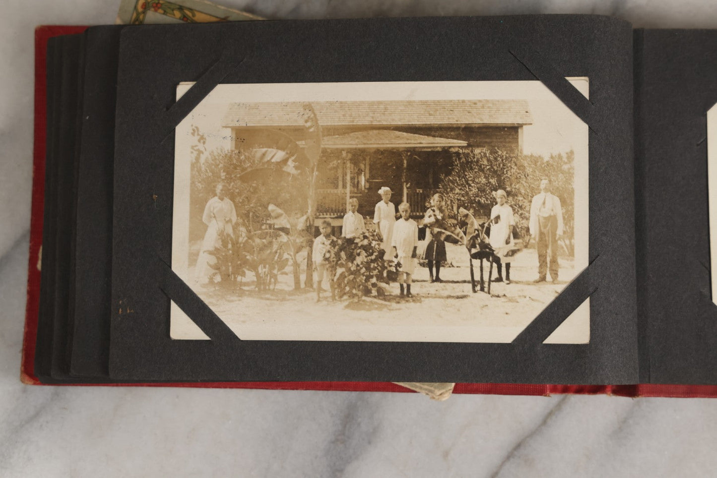 Lot 143 - Antique Postcard Album Containing 50 Postcards Including Numerous Real Photo Postcards R.P.P.C.S With World War One Soldiers, Sailor, Other Portraits, And U.S. Army Souvenir Postcard Folder