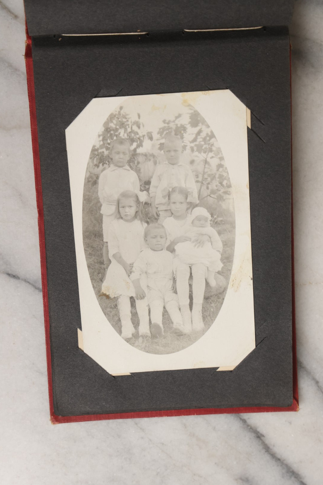 Lot 143 - Antique Postcard Album Containing 50 Postcards Including Numerous Real Photo Postcards R.P.P.C.S With World War One Soldiers, Sailor, Other Portraits, And U.S. Army Souvenir Postcard Folder