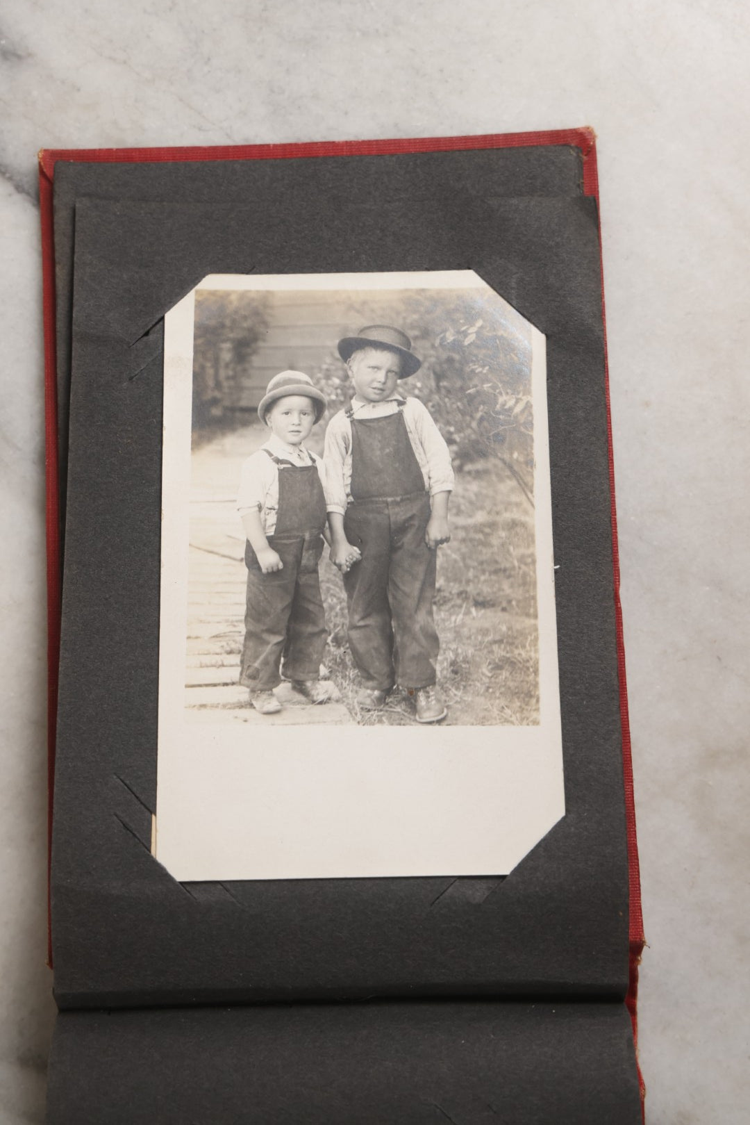 Lot 143 - Antique Postcard Album Containing 50 Postcards Including Numerous Real Photo Postcards R.P.P.C.S With World War One Soldiers, Sailor, Other Portraits, And U.S. Army Souvenir Postcard Folder