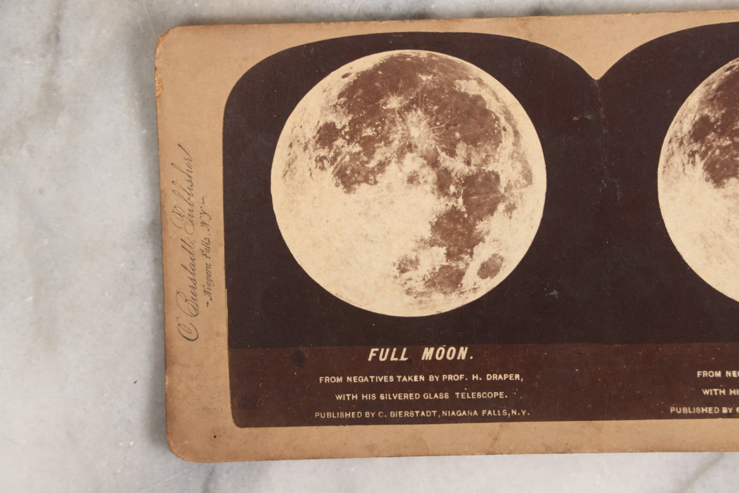 Lot 145 - Antique Photographic Stereoview Of The Full Moon From Negatives Taken By Prof. H. Draper With His Silvered Glass Telescope, Published By C. Bierstadt, Niagara Falls, New York, And Sold By Underwood And Underwood