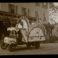 Lot 148 - Vintage Glass Plate Photographic Negative Of Parade Float Decorated With American Flags, Pennants, And Bunting Featuring Woman As Statue Of Liberty And Taxidermy Mount On The Street