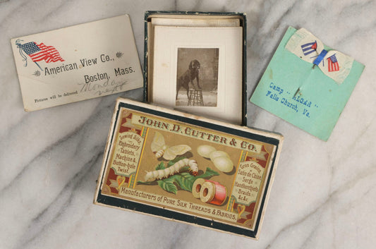 Lot 151 - Antique Box Lot Of Fifteen “Pocket Kodak” Miniature Boarded Photographs Including Dog On Stool, Boys Smoking Pipes, And Man In Workshop, With Camp Alger Flag Pin And American Views Co. Trade Card In John D. Cutter & Co. Chromolithograph Box