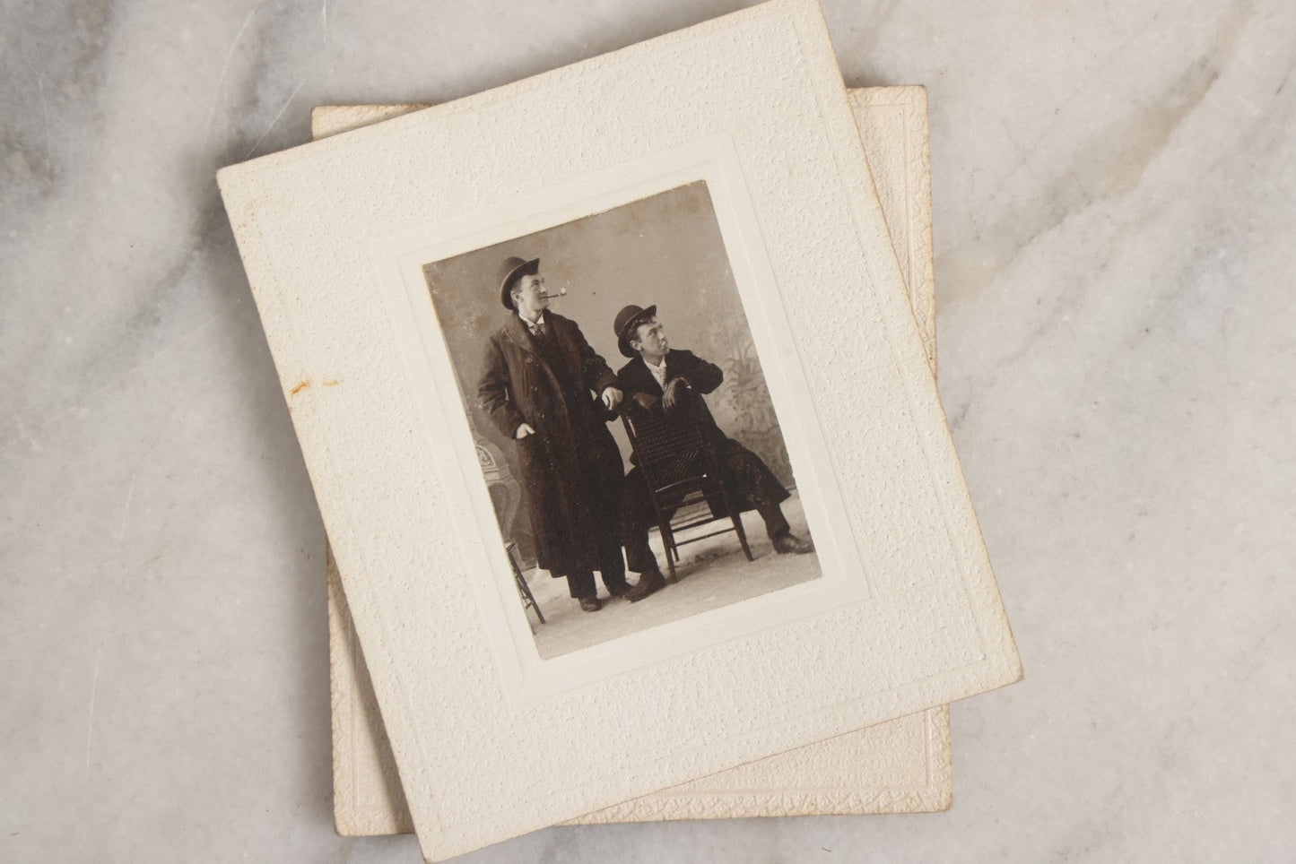 Lot 151 - Antique Box Lot Of Fifteen “Pocket Kodak” Miniature Boarded Photographs Including Dog On Stool, Boys Smoking Pipes, And Man In Workshop, With Camp Alger Flag Pin And American Views Co. Trade Card In John D. Cutter & Co. Chromolithograph Box