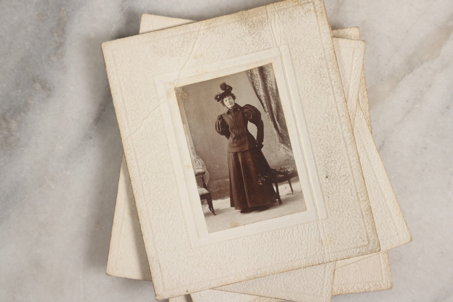 Lot 151 - Antique Box Lot Of Fifteen “Pocket Kodak” Miniature Boarded Photographs Including Dog On Stool, Boys Smoking Pipes, And Man In Workshop, With Camp Alger Flag Pin And American Views Co. Trade Card In John D. Cutter & Co. Chromolithograph Box