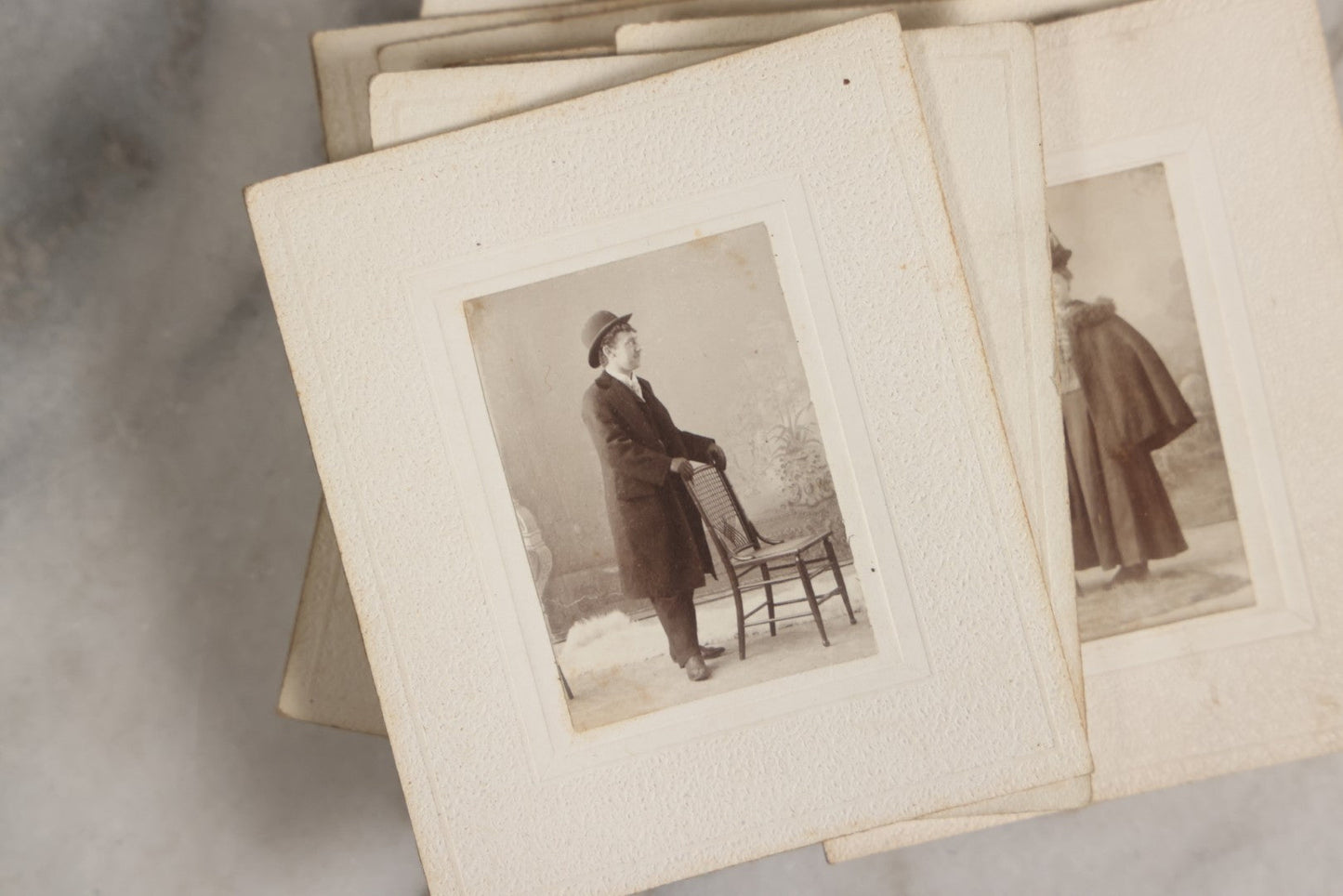 Lot 151 - Antique Box Lot Of Fifteen “Pocket Kodak” Miniature Boarded Photographs Including Dog On Stool, Boys Smoking Pipes, And Man In Workshop, With Camp Alger Flag Pin And American Views Co. Trade Card In John D. Cutter & Co. Chromolithograph Box