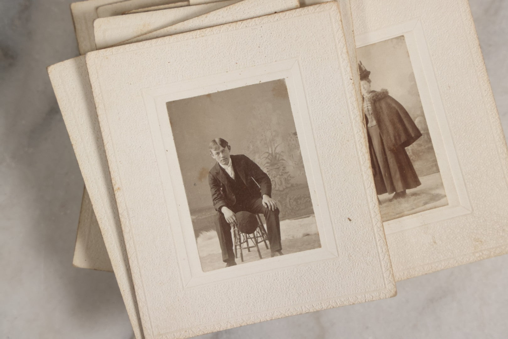 Lot 151 - Antique Box Lot Of Fifteen “Pocket Kodak” Miniature Boarded Photographs Including Dog On Stool, Boys Smoking Pipes, And Man In Workshop, With Camp Alger Flag Pin And American Views Co. Trade Card In John D. Cutter & Co. Chromolithograph Box