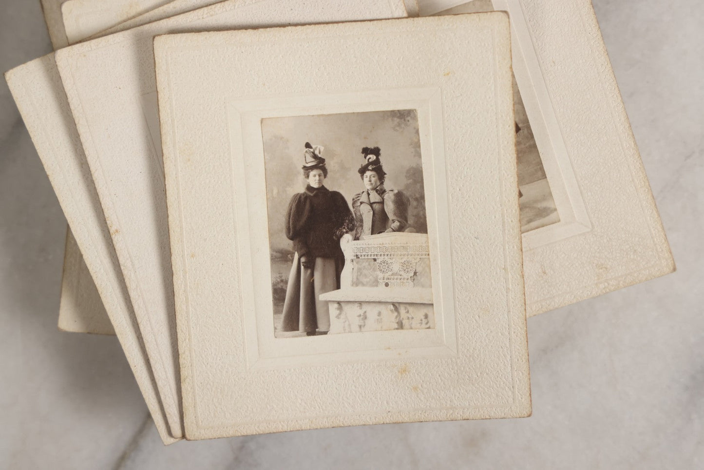 Lot 151 - Antique Box Lot Of Fifteen “Pocket Kodak” Miniature Boarded Photographs Including Dog On Stool, Boys Smoking Pipes, And Man In Workshop, With Camp Alger Flag Pin And American Views Co. Trade Card In John D. Cutter & Co. Chromolithograph Box