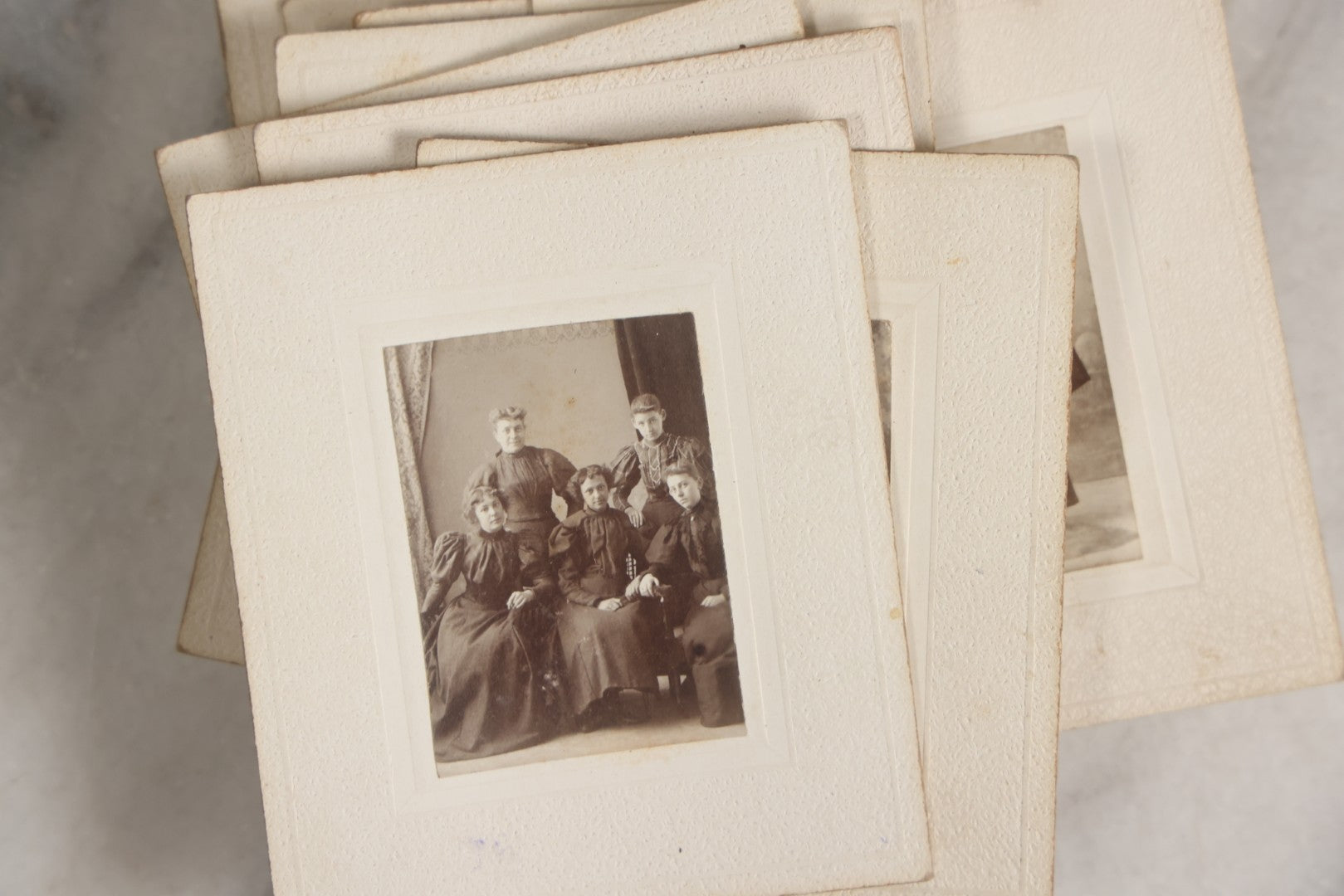 Lot 151 - Antique Box Lot Of Fifteen “Pocket Kodak” Miniature Boarded Photographs Including Dog On Stool, Boys Smoking Pipes, And Man In Workshop, With Camp Alger Flag Pin And American Views Co. Trade Card In John D. Cutter & Co. Chromolithograph Box