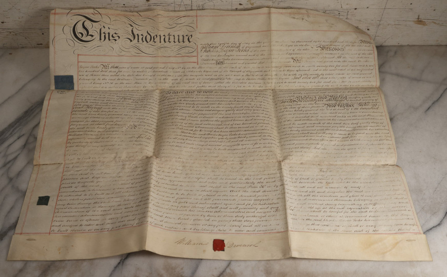 Lot 175 - Antique 1843 Property Indenture Document With Ornate Calligraphy, Red Pinstriping, And Revenue Stamps, Note Holes And Wear To Folded Edges And Corners