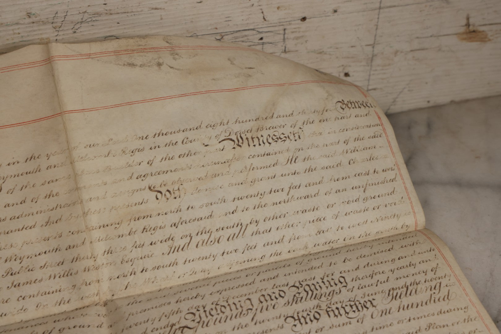 Lot 175 - Antique 1843 Property Indenture Document With Ornate Calligraphy, Red Pinstriping, And Revenue Stamps, Note Holes And Wear To Folded Edges And Corners