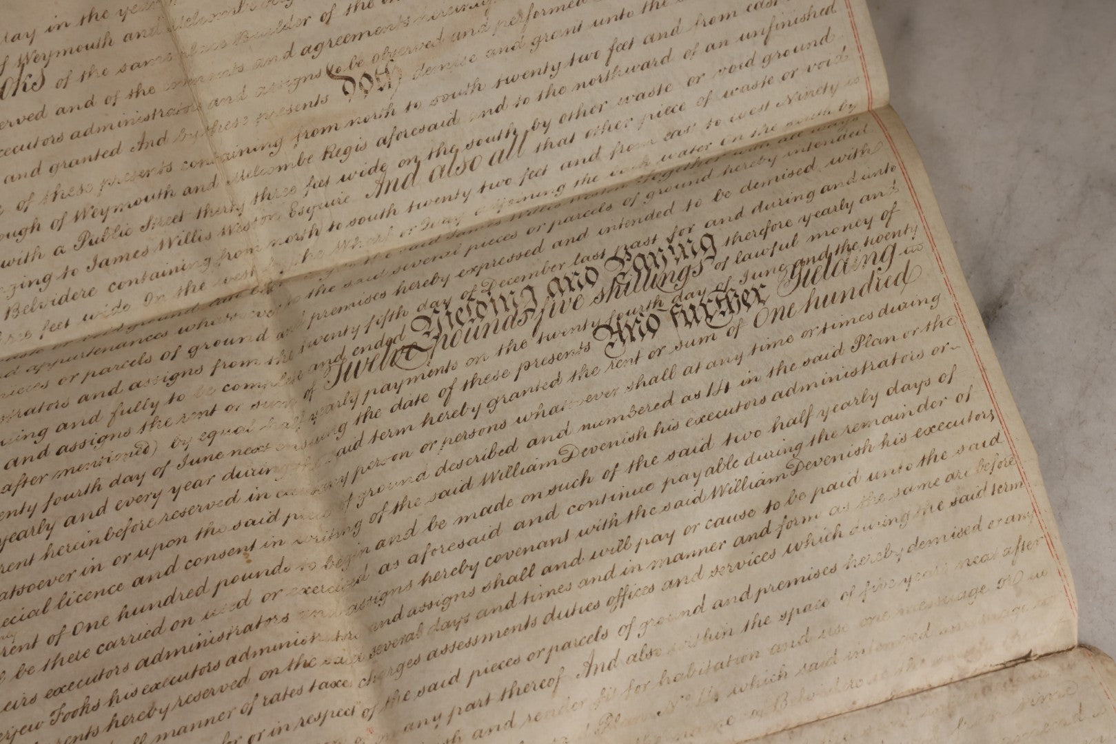 Lot 175 - Antique 1843 Property Indenture Document With Ornate Calligraphy, Red Pinstriping, And Revenue Stamps, Note Holes And Wear To Folded Edges And Corners