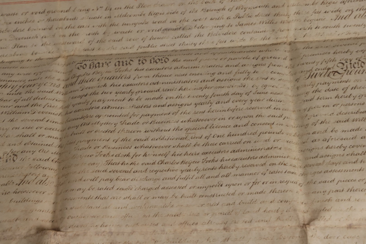 Lot 175 - Antique 1843 Property Indenture Document With Ornate Calligraphy, Red Pinstriping, And Revenue Stamps, Note Holes And Wear To Folded Edges And Corners