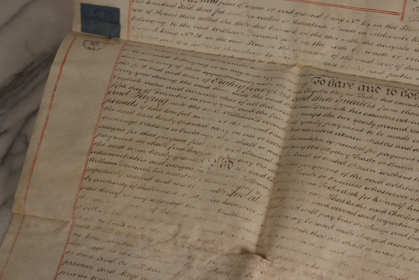 Lot 175 - Antique 1843 Property Indenture Document With Ornate Calligraphy, Red Pinstriping, And Revenue Stamps, Note Holes And Wear To Folded Edges And Corners