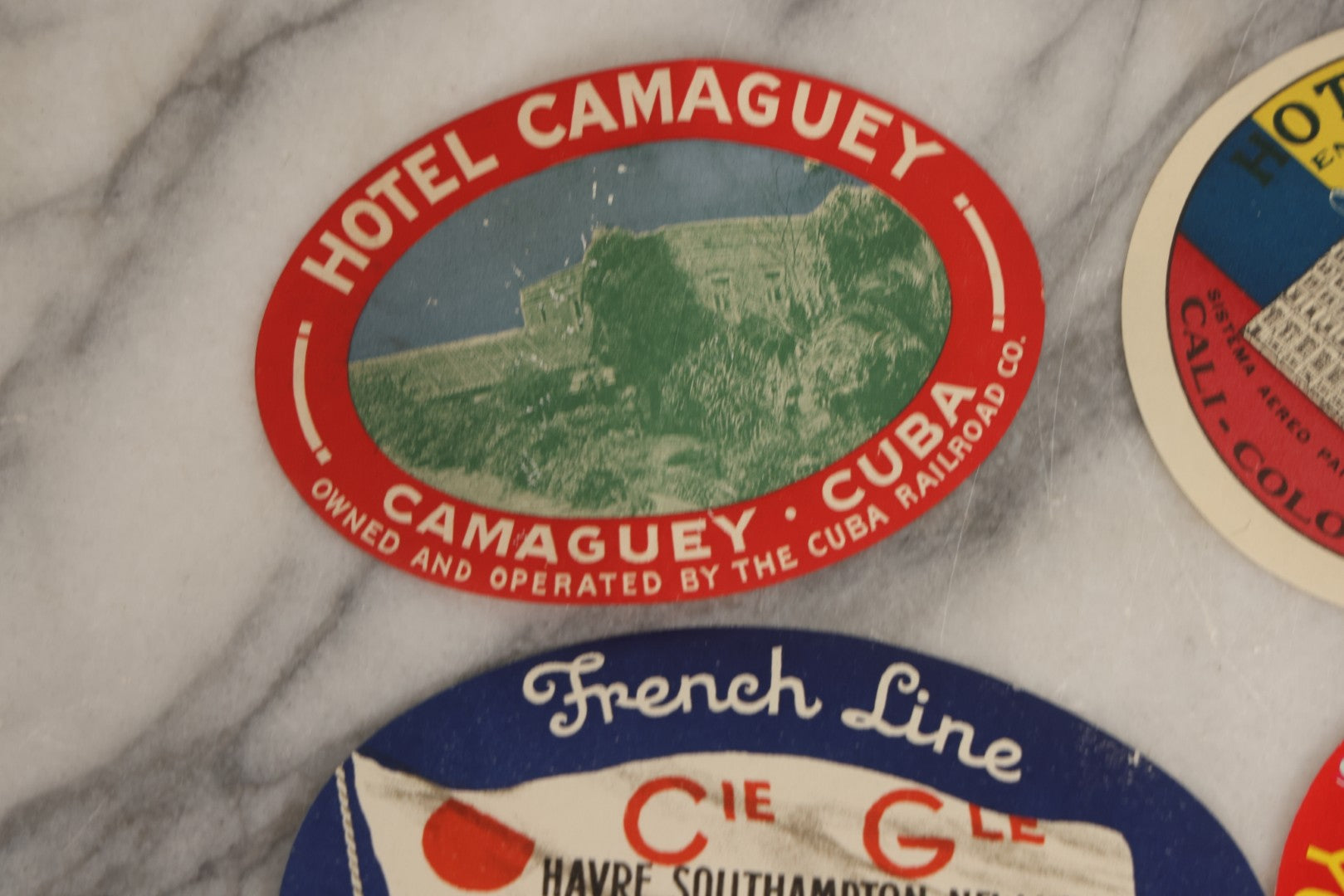 Lot 179 - Grouping Of 12 Vintage Travel Decals Including Fujimatsu Hotel Yokohama Japan, Hotel Camaguey Cuba, Grand Coulee Dam Washington, Death Valley 49ers Member