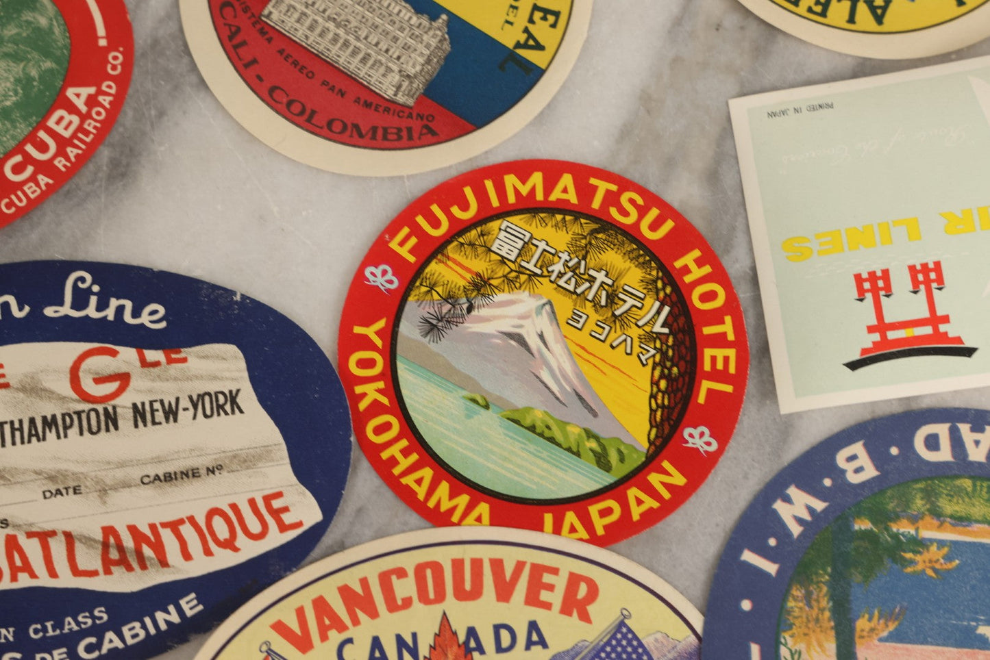 Lot 179 - Grouping Of 12 Vintage Travel Decals Including Fujimatsu Hotel Yokohama Japan, Hotel Camaguey Cuba, Grand Coulee Dam Washington, Death Valley 49ers Member