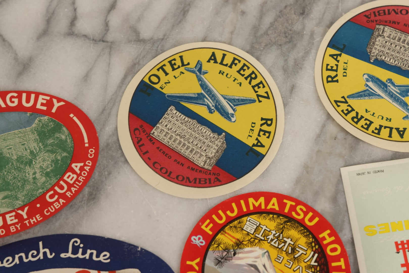 Lot 179 - Grouping Of 12 Vintage Travel Decals Including Fujimatsu Hotel Yokohama Japan, Hotel Camaguey Cuba, Grand Coulee Dam Washington, Death Valley 49ers Member
