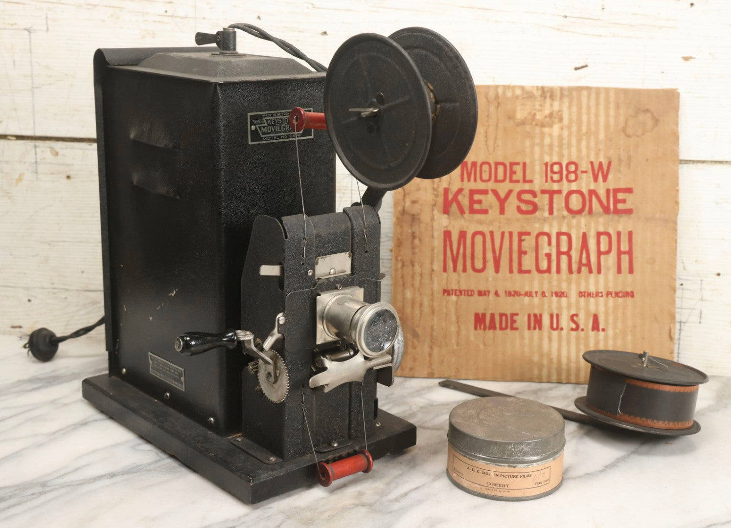 Lot 001 - Antique Keystone Moviegraph Hand-Crank 35Mm Motion Picture Film Toy Projector, Model 198-W, Patented 1920, With Period Comedy Film And Portion Of Original Box