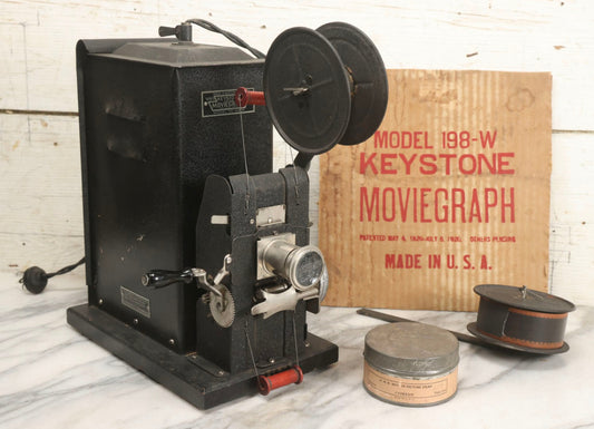 Lot 001 - Antique Keystone Moviegraph Hand-Crank 35Mm Motion Picture Film Toy Projector, Model 198-W, Patented 1920, With Period Comedy Film And Portion Of Original Box