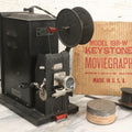 Lot 001 - Antique Keystone Moviegraph Hand-Crank 35Mm Motion Picture Film Toy Projector, Model 198-W, Patented 1920, With Period Comedy Film And Portion Of Original Box
