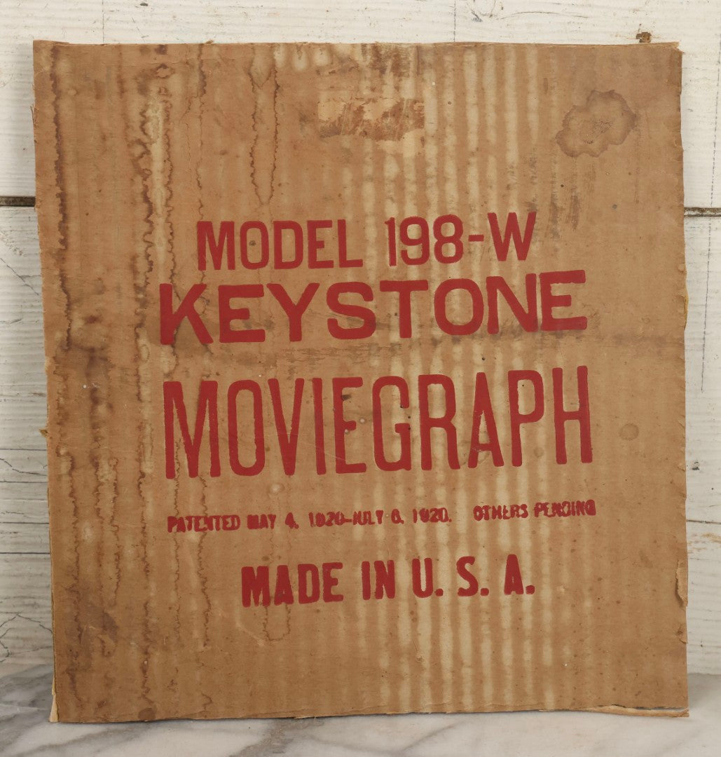 Lot 001 - Antique Keystone Moviegraph Hand-Crank 35Mm Motion Picture Film Toy Projector, Model 198-W, Patented 1920, With Period Comedy Film And Portion Of Original Box