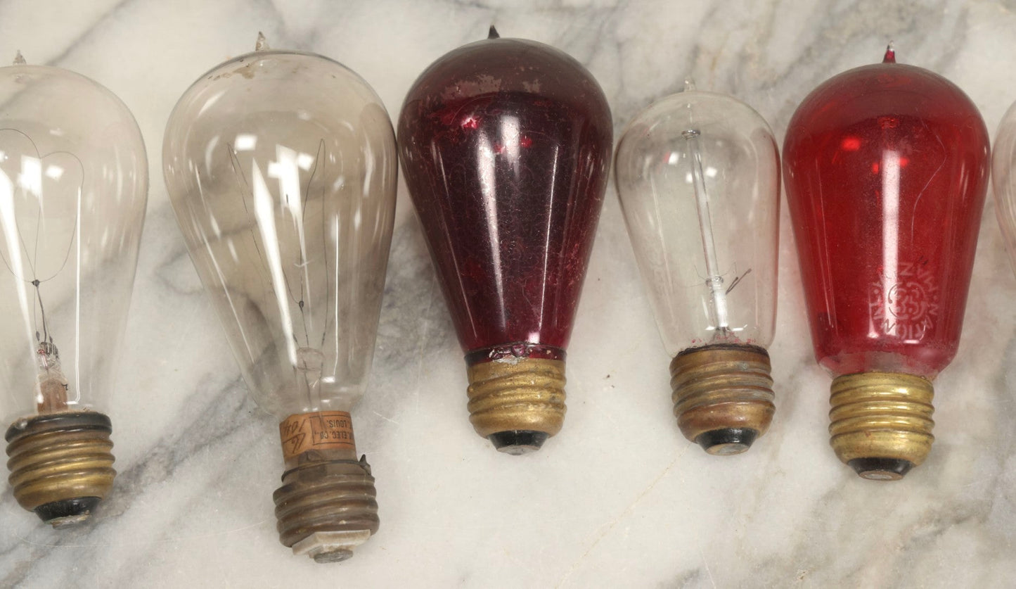 Lot 012 - Grouping Of Seven Antique Edison Style Incandescent Light Bulbs With Mixed Makers Including Bryan Marsh Imperial, Miller Patent 1902, National Mazda General Electric, Red And Clear Examples