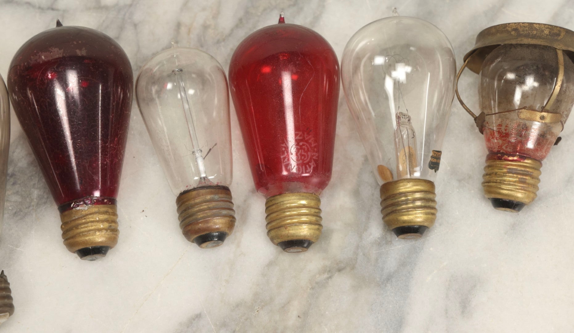 Lot 012 - Grouping Of Seven Antique Edison Style Incandescent Light Bulbs With Mixed Makers Including Bryan Marsh Imperial, Miller Patent 1902, National Mazda General Electric, Red And Clear Examples