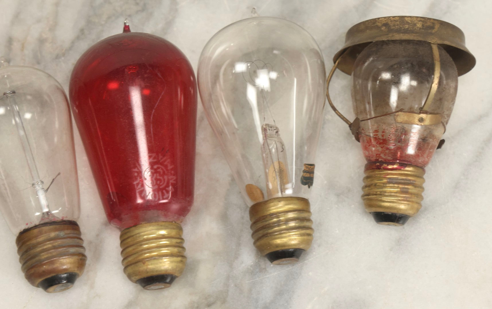 Lot 012 - Grouping Of Seven Antique Edison Style Incandescent Light Bulbs With Mixed Makers Including Bryan Marsh Imperial, Miller Patent 1902, National Mazda General Electric, Red And Clear Examples