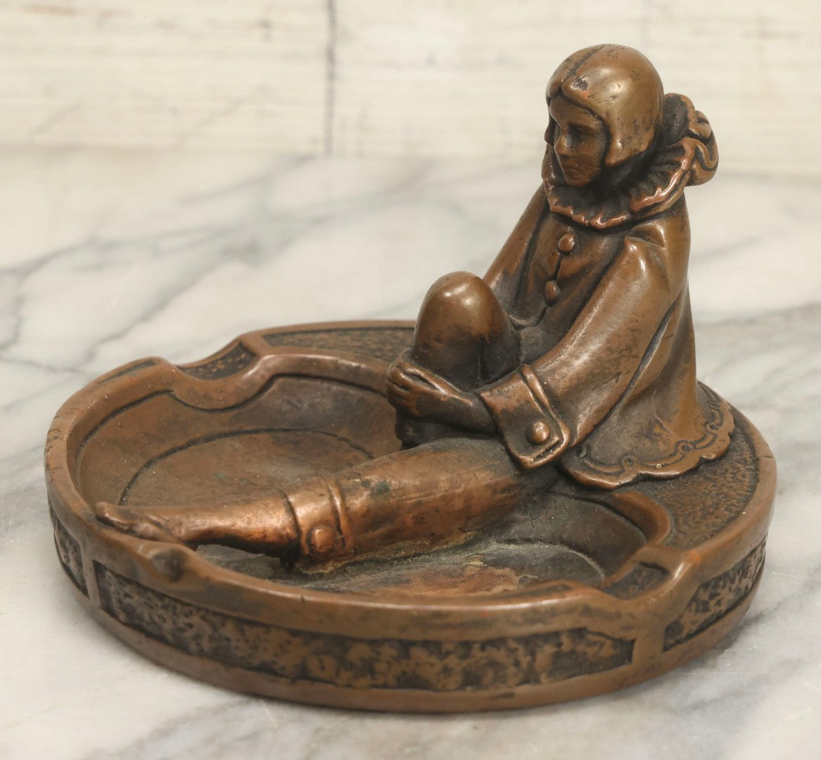 Lot 017 - Antique Art Deco Pierrot Clown Chalkware Ashtray With Bronzed Metal Shell And Figural Female Form, 6-1/8" Diameter
