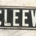 Lot 033 - Vintage Pressed Metal Street Sign "Van Cleeve St." With Raised White Lettering, 24" x 4-1/2"
