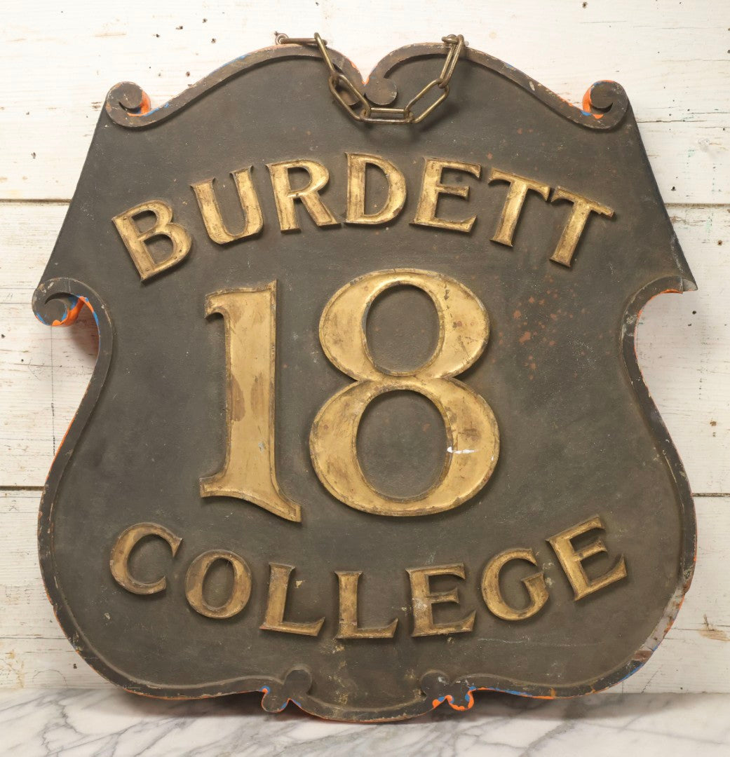 Lot 034 - Double-Sided Wooden Shield-Form Sign With Raised Letters “Burdett 18 College” And Modern Repurposed Side Painted “Last Chance Saloon," Note Missing Corner Scroll Piece And Large Crack In Other Scroll Corner, 25-1/2" x 26"