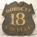 Lot 034 - Double-Sided Wooden Shield-Form Sign With Raised Letters “Burdett 18 College” And Modern Repurposed Side Painted “Last Chance Saloon," Note Missing Corner Scroll Piece And Large Crack In Other Scroll Corner, 25-1/2" x 26"