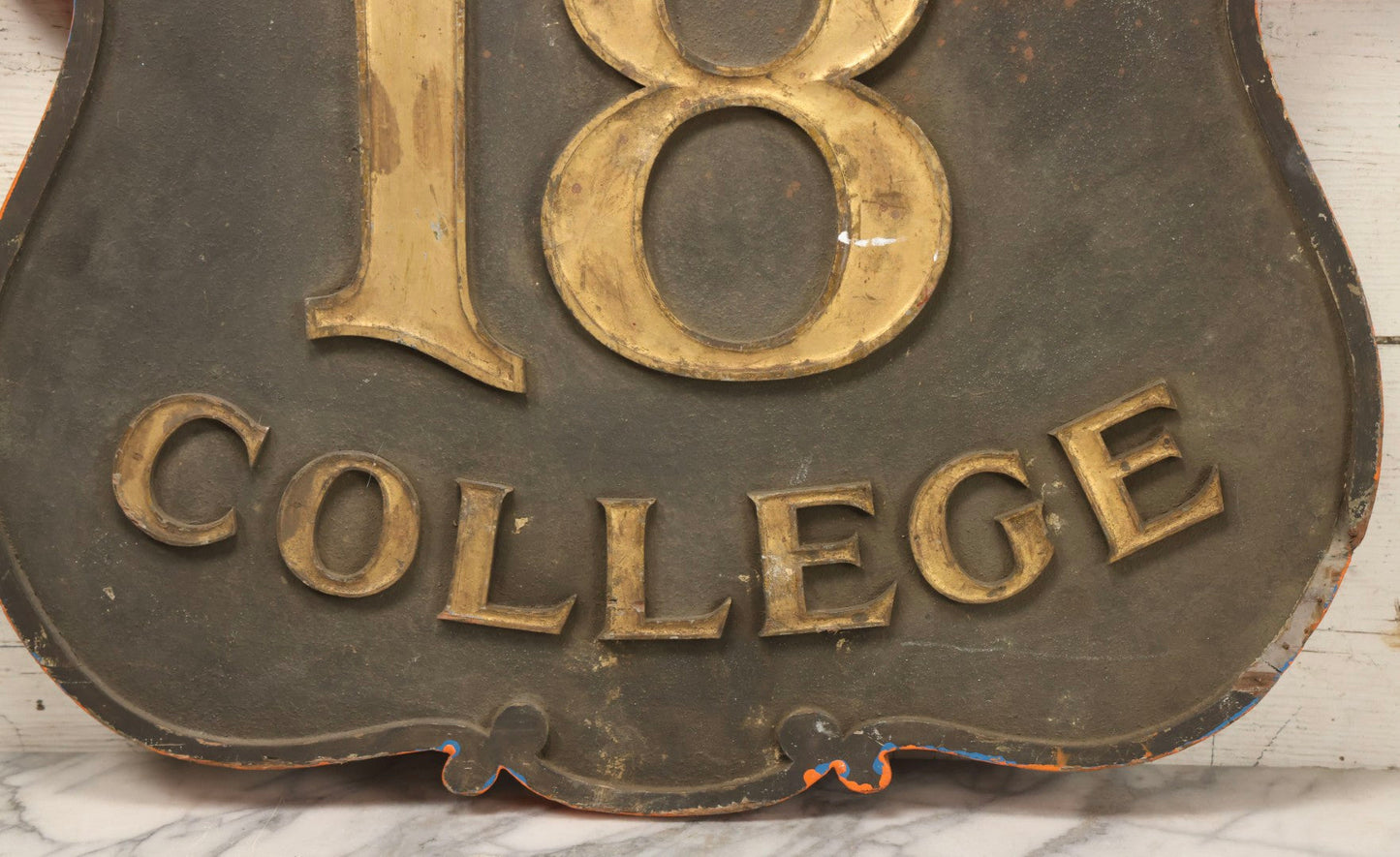 Lot 034 - Double-Sided Wooden Shield-Form Sign With Raised Letters “Burdett 18 College” And Modern Repurposed Side Painted “Last Chance Saloon," Note Missing Corner Scroll Piece And Large Crack In Other Scroll Corner, 25-1/2" x 26"