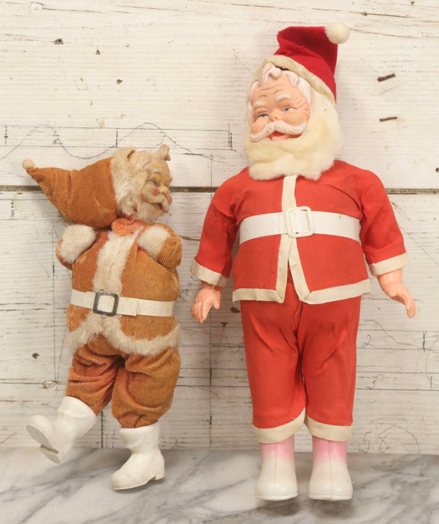 Lot 052 - Pair Of Vintage Plastic Santa Claus Christmas Dolls With Fabric Clothing, Circa 1960s 14-1/2" H And 10-1/2" H
