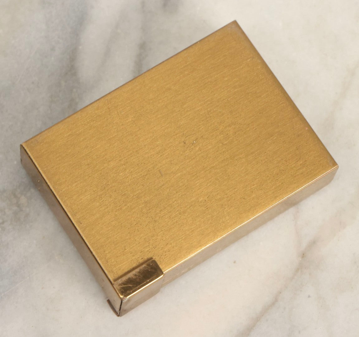 Lot 059 - Vintage Volupte Brass Makeup Compact With Pull-Out Lipstick Holder And Wind Up Musical Box, Made In U.S.A..