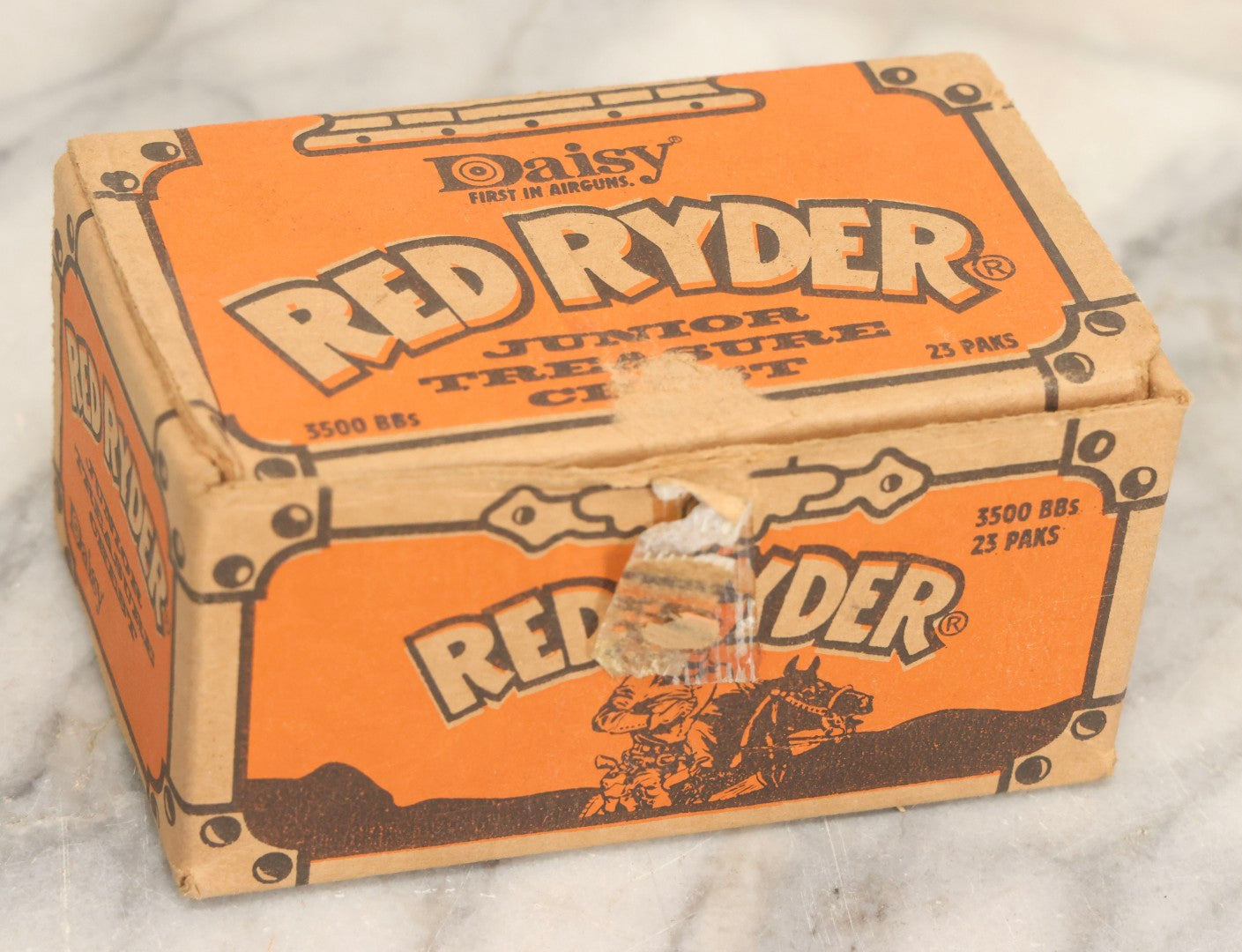 Lot 066 - Grouping Of Three Vintage Advertising Cardboard Boxes With Contents Including Daisy Red Ryder B.B.s Shakespeare Fishing Reel, And Ford Ignition Coil