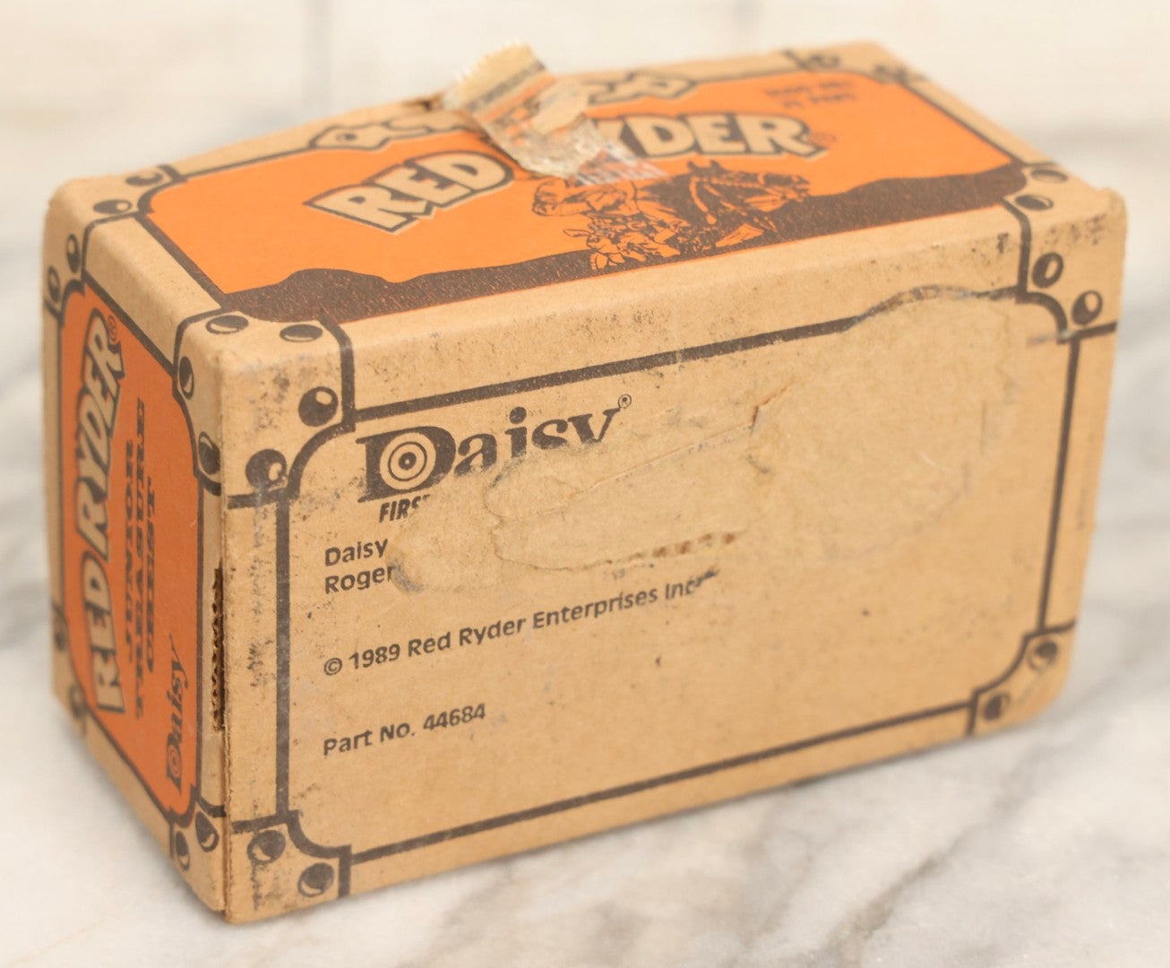 Lot 066 - Grouping Of Three Vintage Advertising Cardboard Boxes With Contents Including Daisy Red Ryder B.B.s Shakespeare Fishing Reel, And Ford Ignition Coil