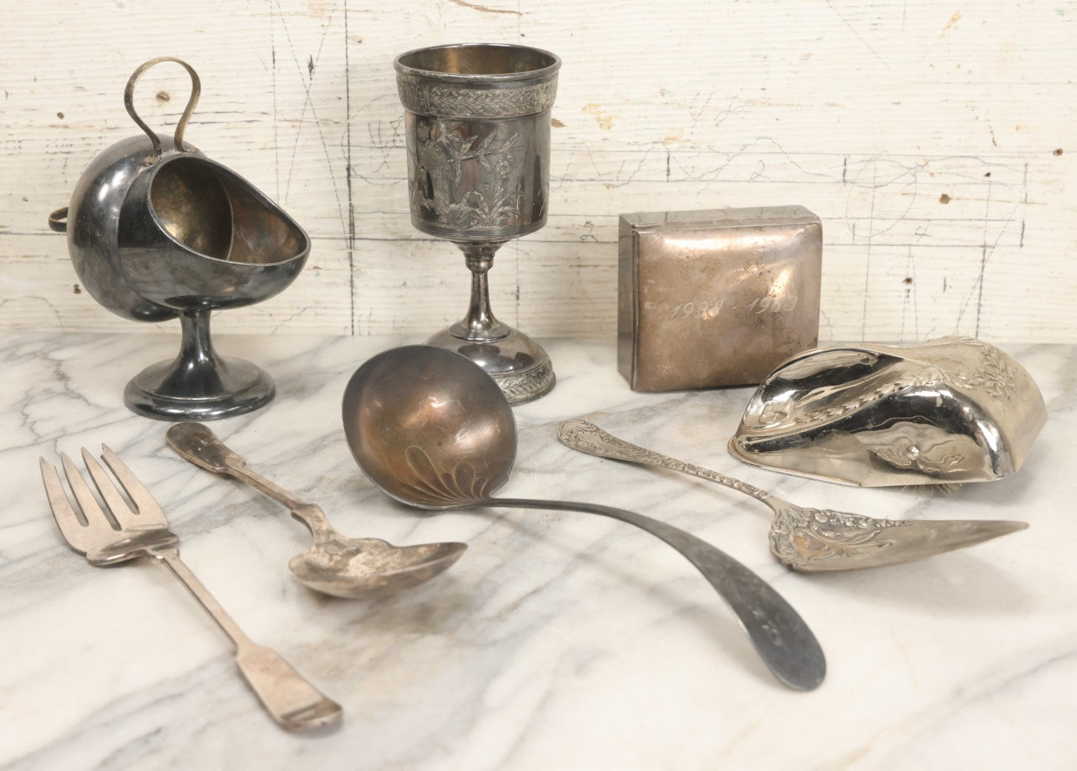 Lot 069 - Eight-Piece Vintage Silverplate Tableware And Accessories Lot Including Engraved Chalice, “The Crumber” Table Sweeper, Sugar Scuttle, Utensils, And 1938-1963 25th Anniversary Presentation Box