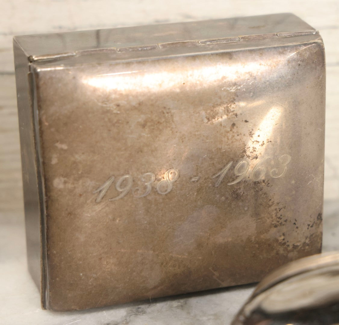 Lot 069 - Eight-Piece Vintage Silverplate Tableware And Accessories Lot Including Engraved Chalice, “The Crumber” Table Sweeper, Sugar Scuttle, Utensils, And 1938-1963 25th Anniversary Presentation Box